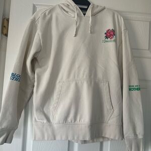 Vans Cream Hoodie with Floral and Text Accents